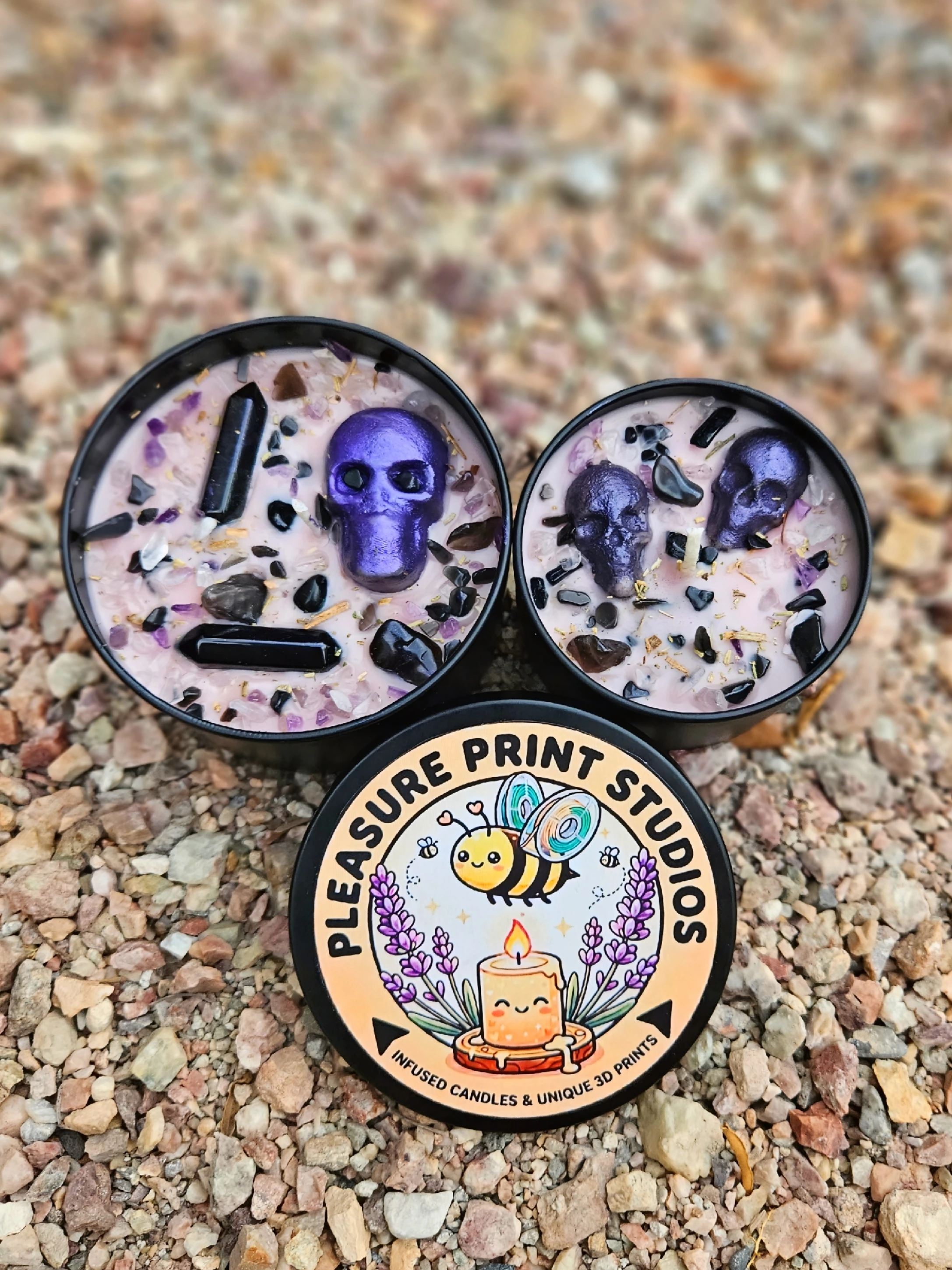 image of three candles with a picture of the pleasure prints logo
